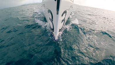 Prow of a sailing boat is sailing through the sea. Slow motion.