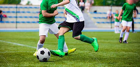 Running Football Soccer Players. Sports Competition Between Youth Soccer Teams