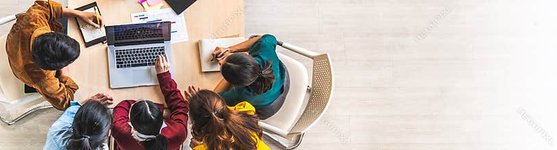 Asian business team work together in project brainstorm meeting, using laptop computer. Colleague coworker, startup office