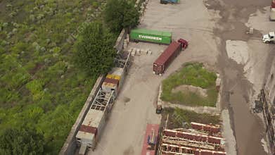 AERIAL: Following Cargo truck with heavy load in docks of New York City Cloudy Grey day
