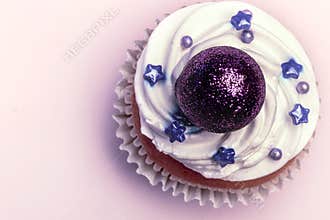 Sweet, colorful cupcakes decorated with sugar paste and cream. Concept of art paty. Flat lay, top veiw
