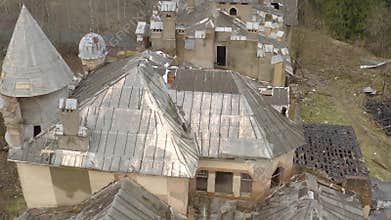 View on dilapidated roof of old building in forest