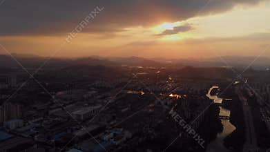 Panoramic city skyline drone footage over city with mountains