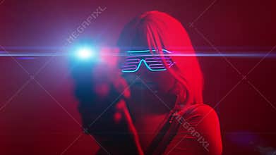 Girl with blaster in the futuristic battle. Concept virtual reality, cyber game.