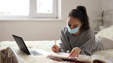 Coronavirus. Business woman working from home wearing protective mask. Business woman in quarantine for coronavirus