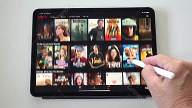 A person looking through Netflix trying to find something to watch