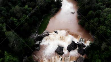 Drone footage - flowing water, small waterfalls and forest all around
