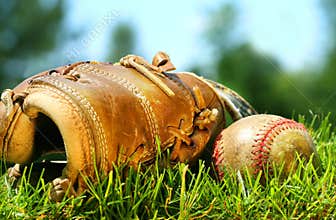 Old baseball glove and ball
