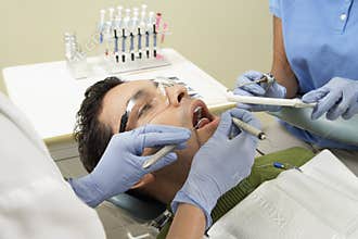 Male Patient At Dentist's Clinic