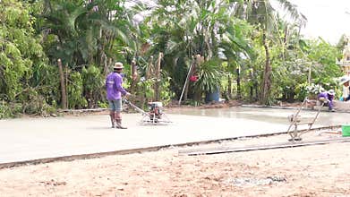 Pour the concrete and Spread cement on bricks floor build , 7 January 2023 , Buriram Thailand.