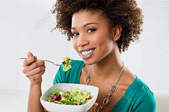 African American Woman Eating Salad