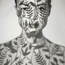 Beautiful lady with floral pattern on face