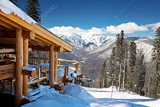 Wooden ski chalet in snow