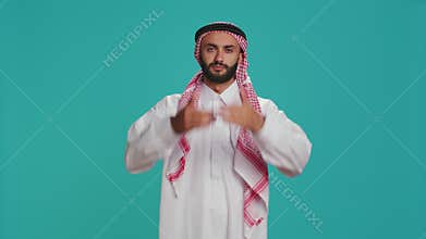 Person doing three wise monkeys sign