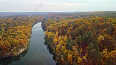 Autumn aerial above river with colorful riverbanks