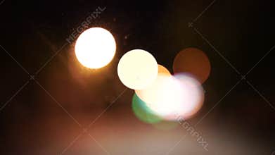 Blurred lights evening city traffic bokeh. Defocused night city traffic. Blurred lights bokeh car headlights driving