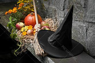 Halloween still life with pumpkins and witch hat