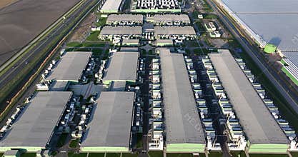 Data technology infrastructure. Information technology hardware, large data center facility aerial drone overhead view.