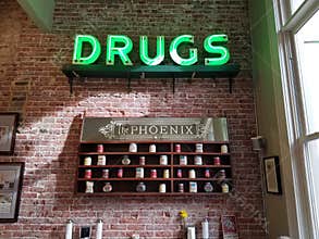 Vintage Neon \"Drugs\" Sign Inside The Phoenix Café