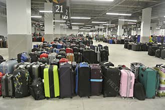 Large Collection of Luggage in Cruise Terminal Baggage Claim Area