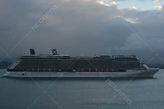 Celebrity Reflection Cruise Ship Sailing Under Cloudy Sky Description: