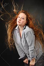 Woman pose in shirt with hair fluttering