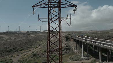 abandoned old rusty high voltage power supply line pylon with damaged wires, 4k