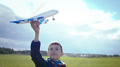 Aspiring Pilot's Sunny Day Adventure: Boy Playing with Toy Plane