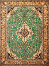 Green Persian carpet with antique pattern on the floor top view