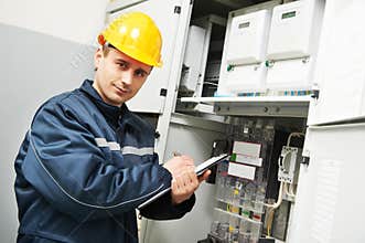 Electrician inspector checking electric meter data