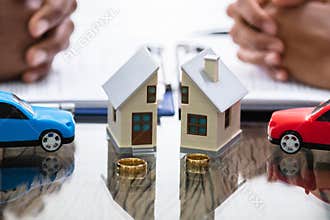 Wife And Husband Splitting House And Car