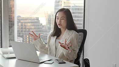 Young Asian business woman communicating by video conference call meeting.