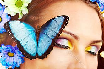 Woman with flower and butterfly.