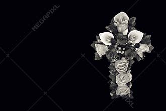 Sympathy or Condolence card with floral cross isolated on black background, copy space