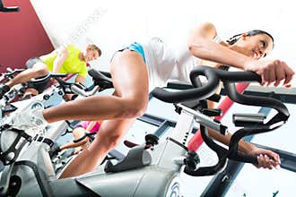 Young People Spinning in the fitness gym