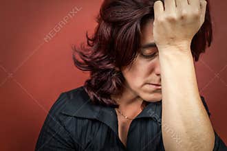 Woman sufffering a headache or a strong depression