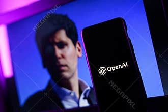 OpenAI logo and Sam Altman in background on screen. OpenAI fires CEO Sam Altman