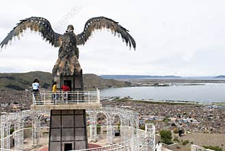 Puno, Peru - Stunning view of the city next to Lake Titicaca, Puno, and Statue of Condor Peru. Lake Titicaca is the largest lake