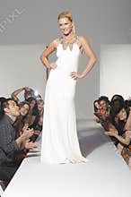 Woman In Bridalwear standing On Fashion Catwalk
