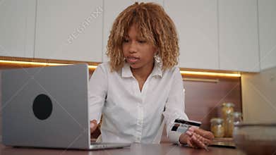 woman paying bills online