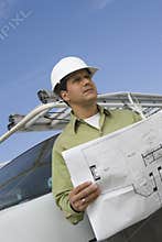 Mature Man Holding Blueprint