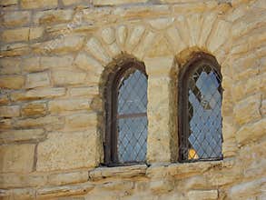 View of arched windows on old castle wall