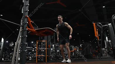 fitness and sport. athletic man jump up. muscular athlete man jump in sport gym.