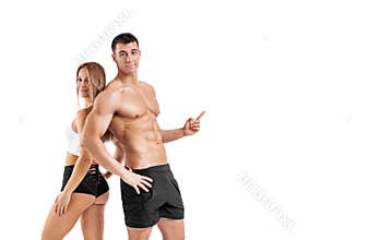 Fit couple at the gym shows on copy space isolated on white background . Fitness concept. Healthy life style. Mr and Mrs