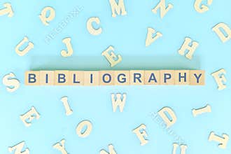 Bibliography part of a book concept. Wooden blocks typography word flat lay