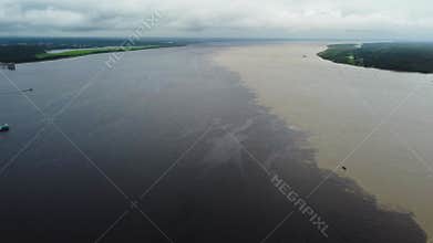 Where two rivers meet the confluence of the Rio negro and Rio Amazon. Aerial Video