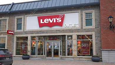 LEVIS Factory Store Banner at store front at Village Shops in Dartmouth. Levi Strauss and Co. is an American worldwide clothing