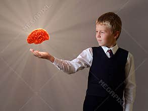 Glowing brain of the child hand