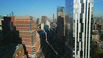 Aerial view of wide street and modern high rise office of apartment downtown buildings in metropolis. New York City, USA