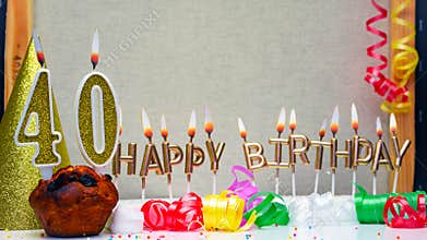 Happy birthday background with golden candles and decorations with candles burning number 40. Colorful festive card happy